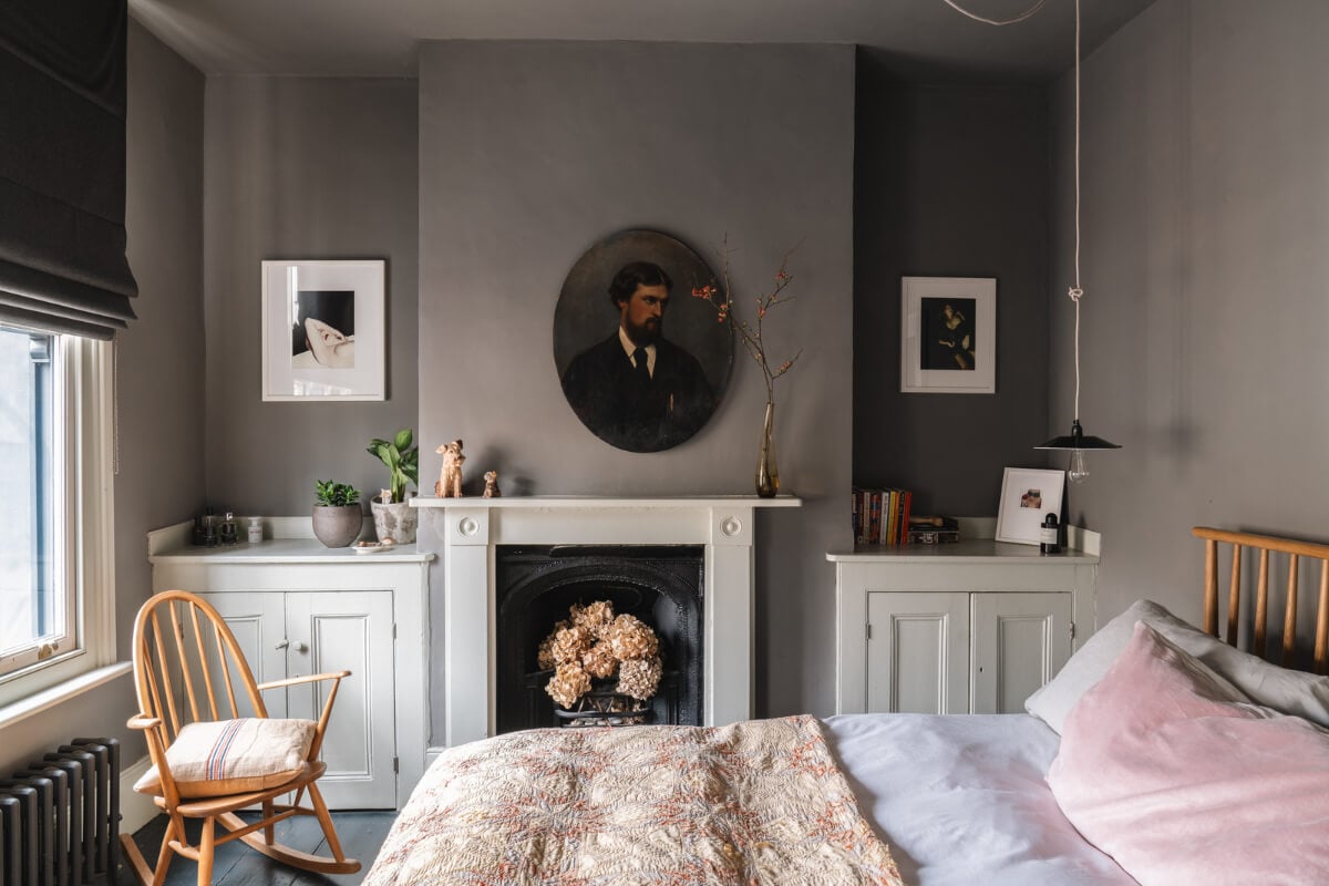 A Cozy Victorian Home Painted in Moody Blue and Gray Tones 16 gray bedroom fireplace