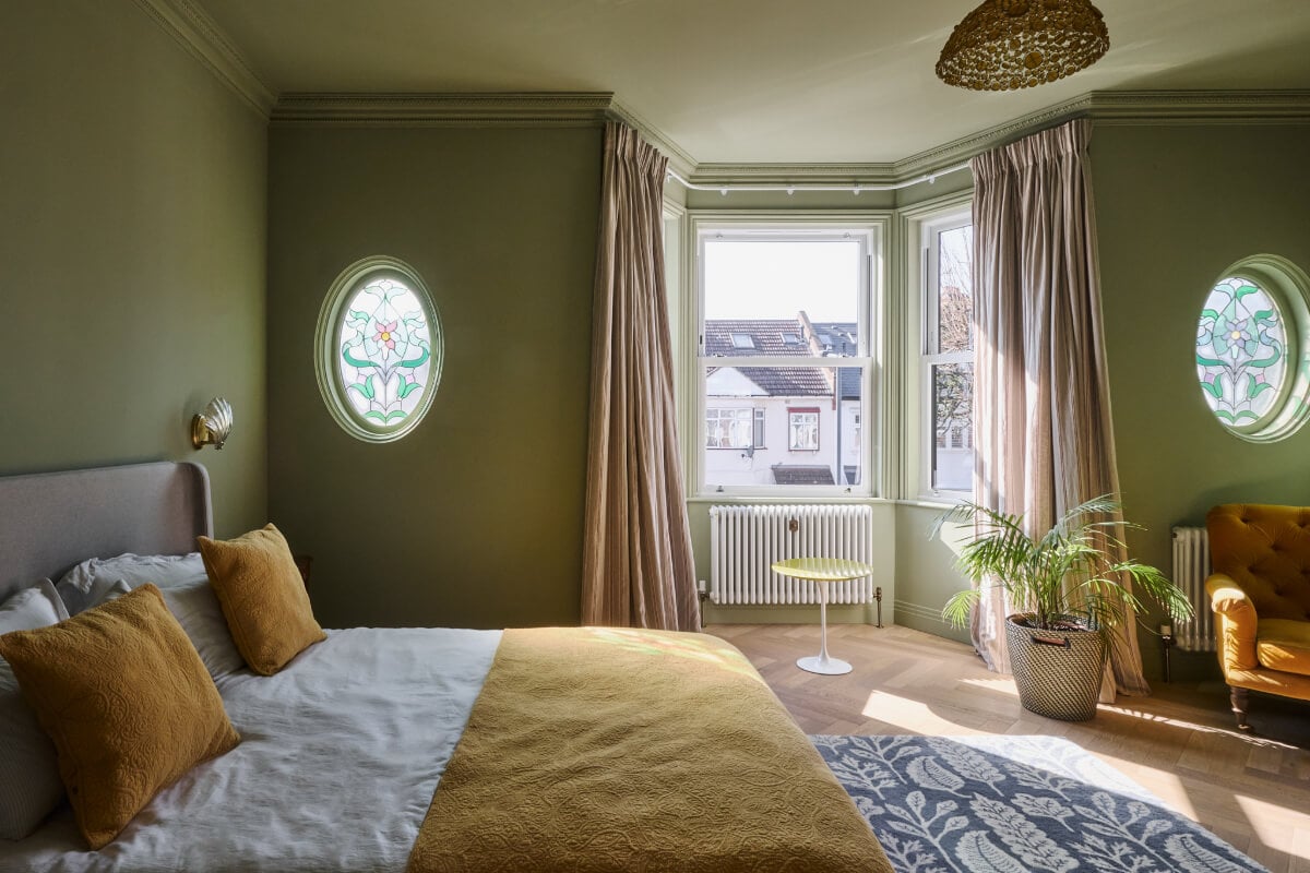 A Beautiful Extended Edwardian House Blends Period Features with Modern Design 17 green bedroom bay window