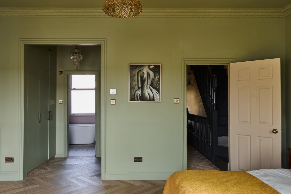A Beautiful Extended Edwardian House Blends Period Features with Modern Design 21 green bedroom dressing room en-suite bathroom