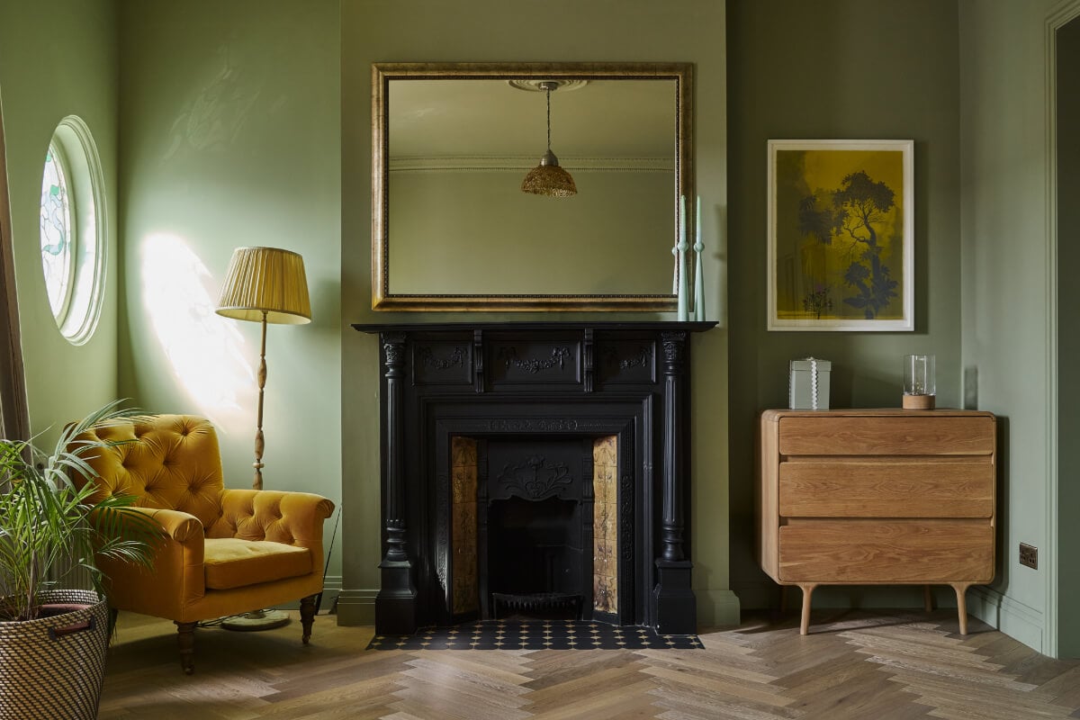 A Beautiful Extended Edwardian House Blends Period Features with Modern Design 19 green bedroom fireplace