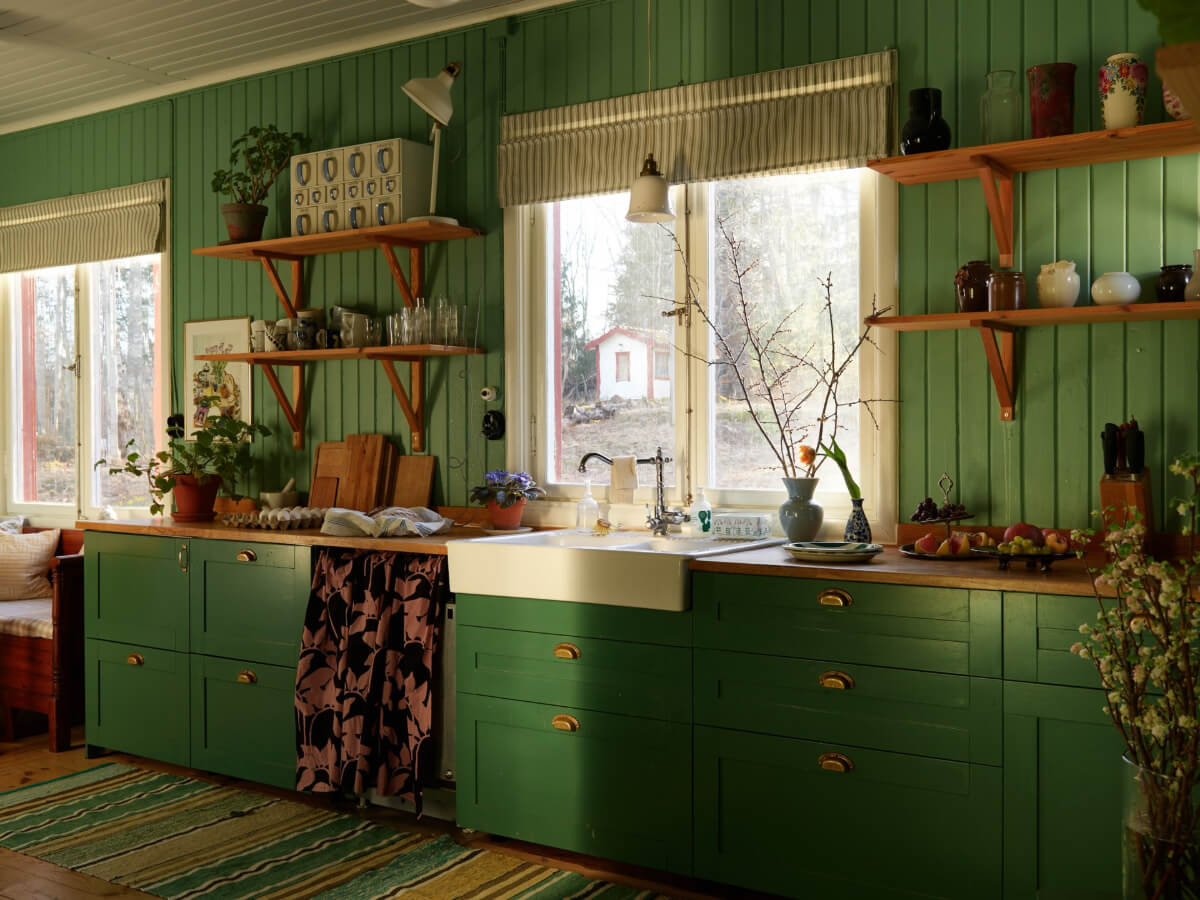 A Grand Family Home in a Former Swedish Doctor's Villa 16 green cabinets and paneling