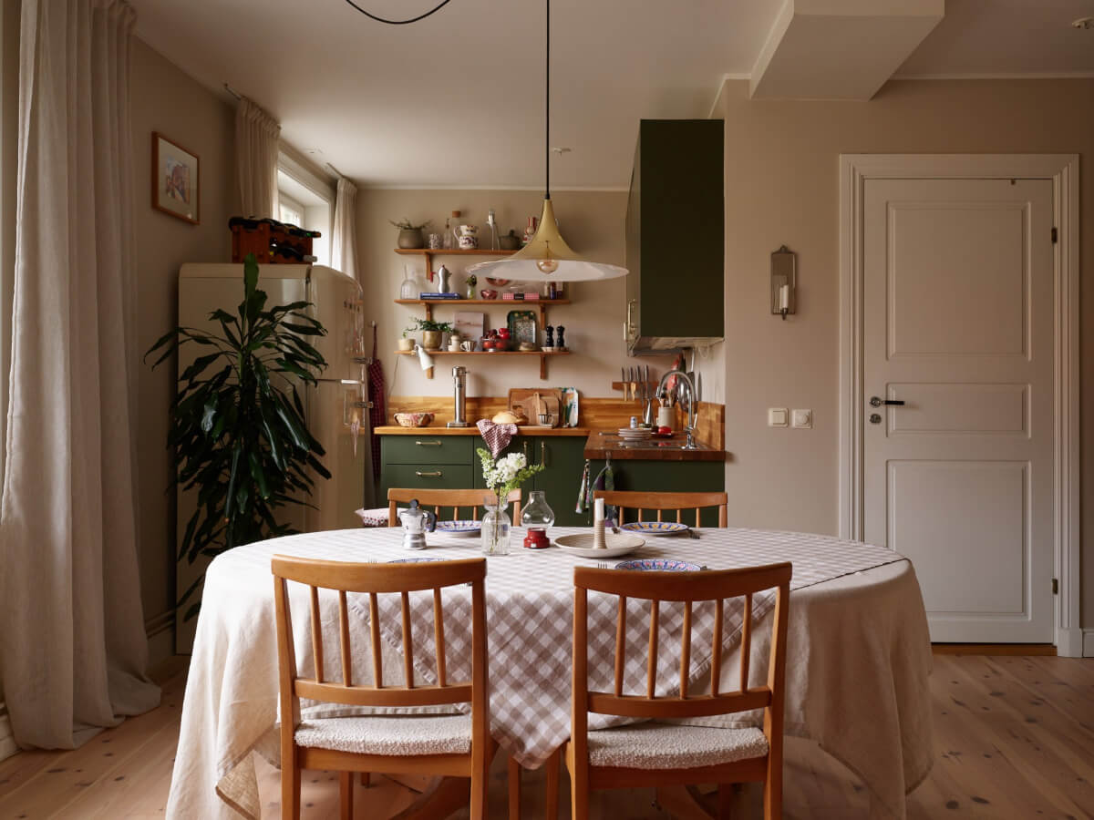 A Green Kitchen and a Pink Bedroom in a Charming Apartment 8 green kitchen large dining table
