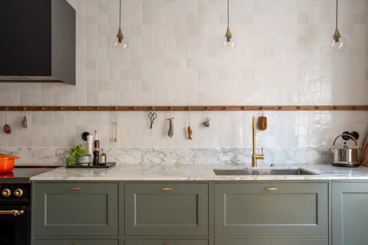 A Green Kitchen in a Classic Scandinavian Apartment 8 green kitchen marble countertop zellige tiles backsplash