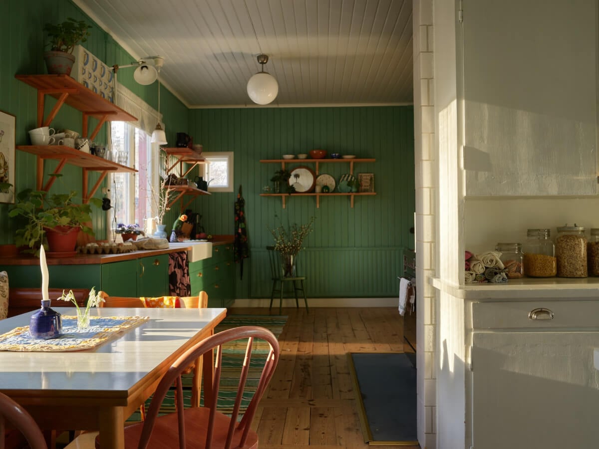 A Grand Family Home in a Former Swedish Doctor's Villa 13 green kitchen with breakfast nook