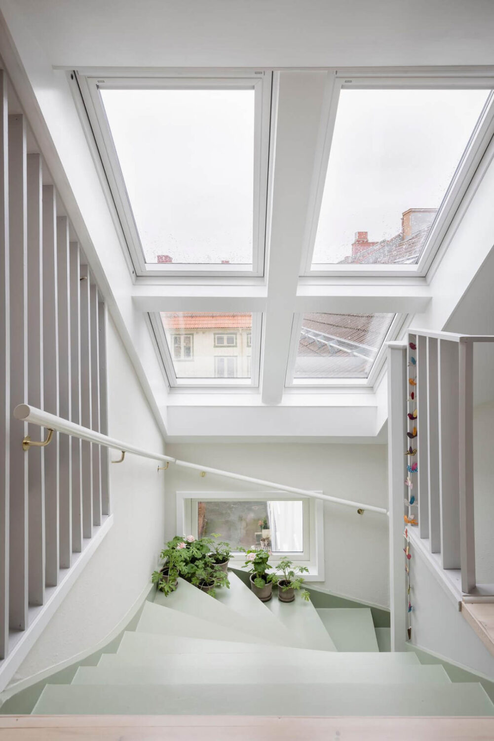 Timeless Charm and Contemporary Design in a 1930s Duplex Apartment 14 green stairs skylights