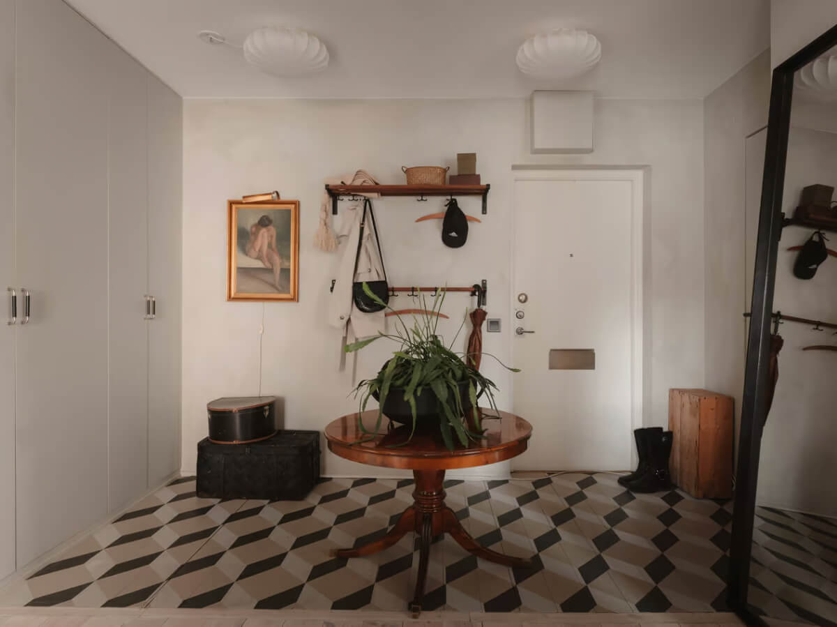 Limewash Walls in Muted Tones in a Swedish Apartment 29 hall built in wardrobes patterned tiles Limewash Walls in Muted Tones in a Swedish Apartment