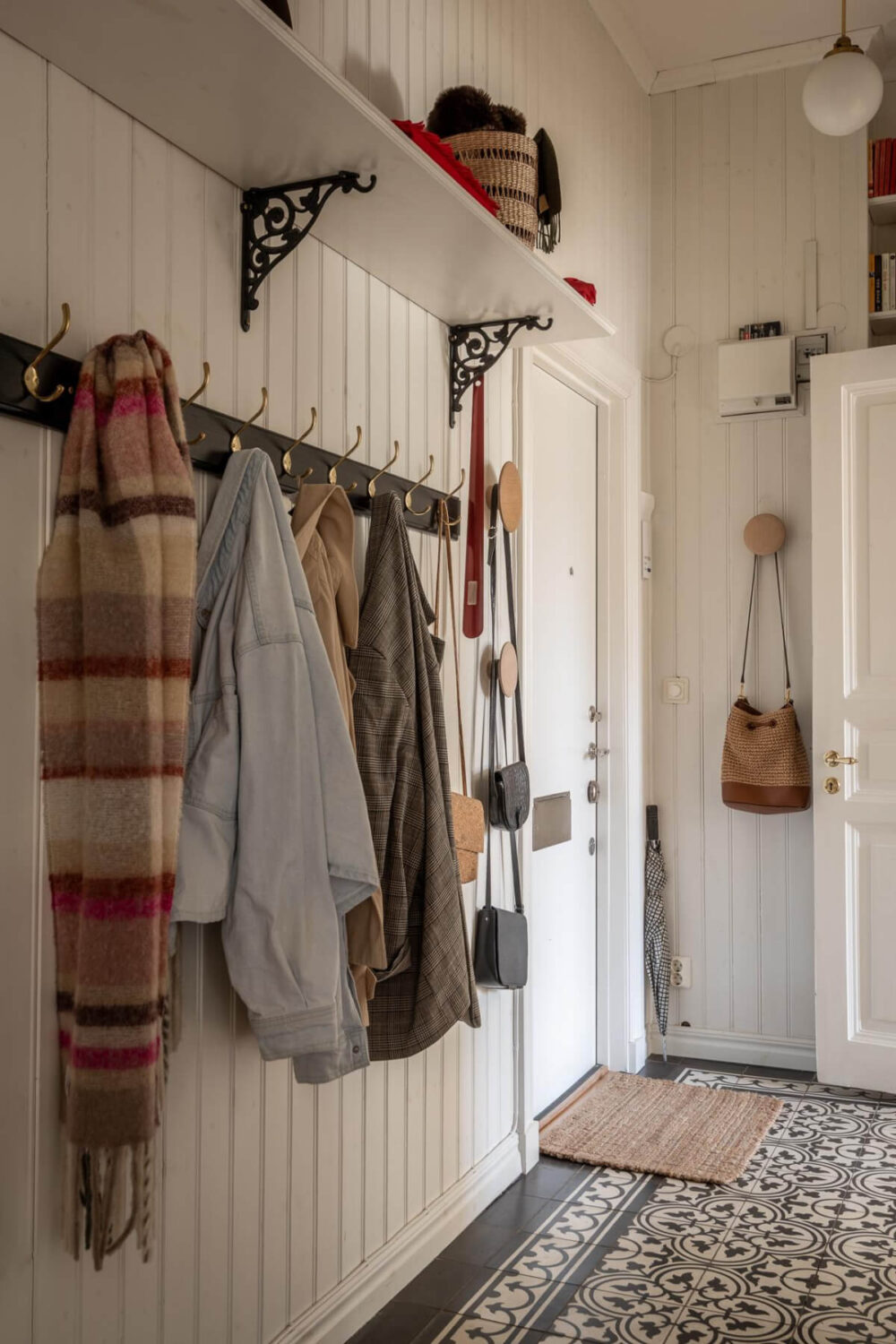 A Light and Spacious Apartment with a Cozy Social Kitchen 26 hall coat storage wood paneled walls A Light and Spacious Apartment with a Cozy Social Kitchen