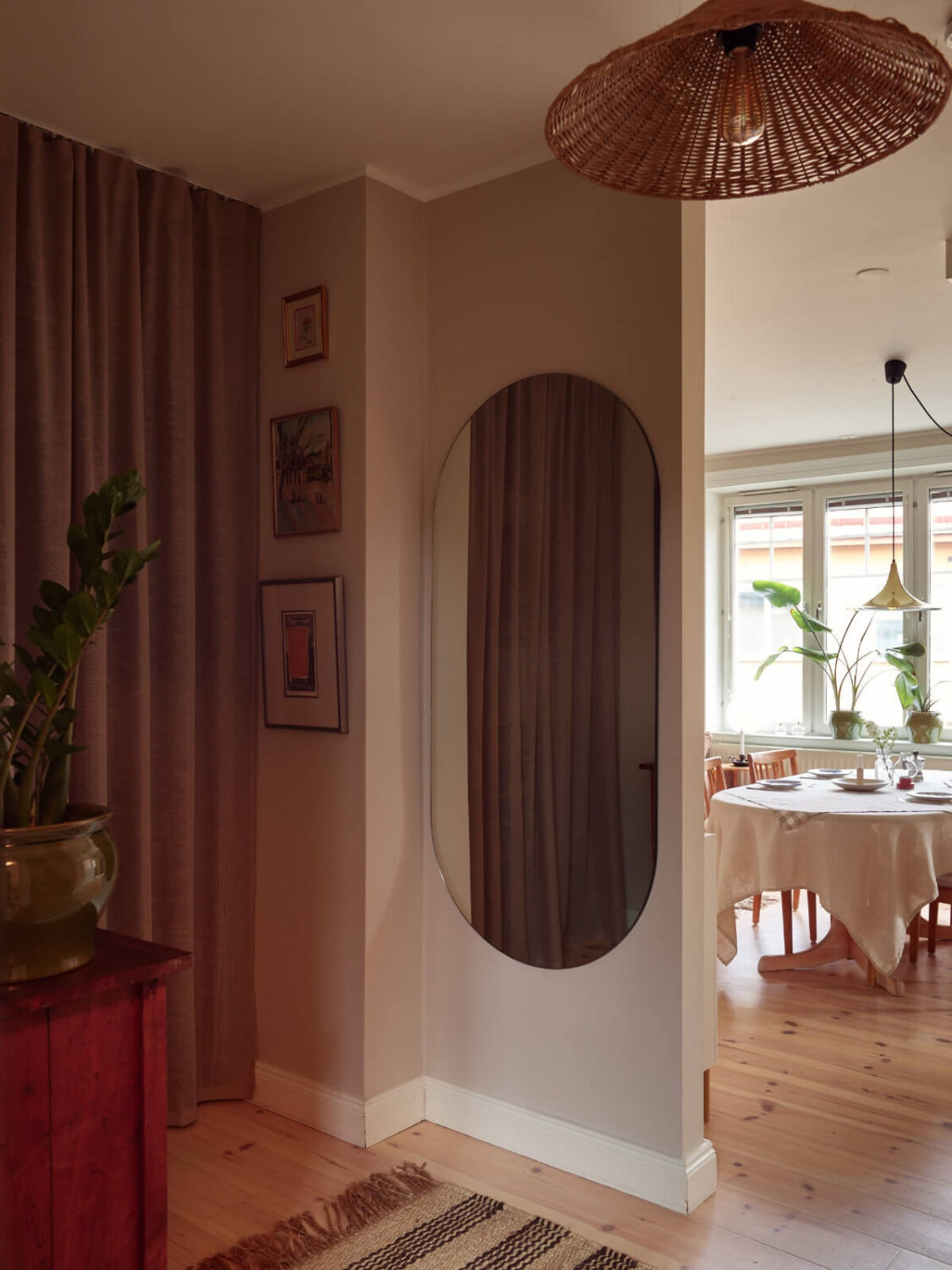 A Green Kitchen and a Pink Bedroom in a Charming Apartment 18 hall large mirror storage behind curtain