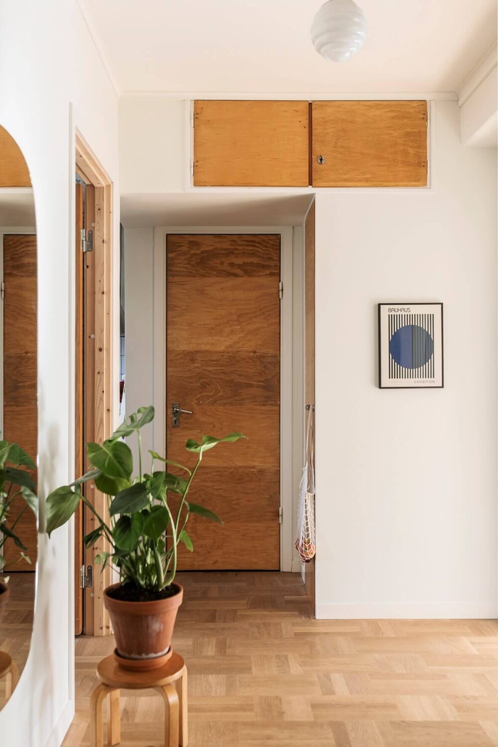 A Two-Bedroom Apartment with the Original Midcentury Kitchen 18 hall with built-in cabinets above doorframe