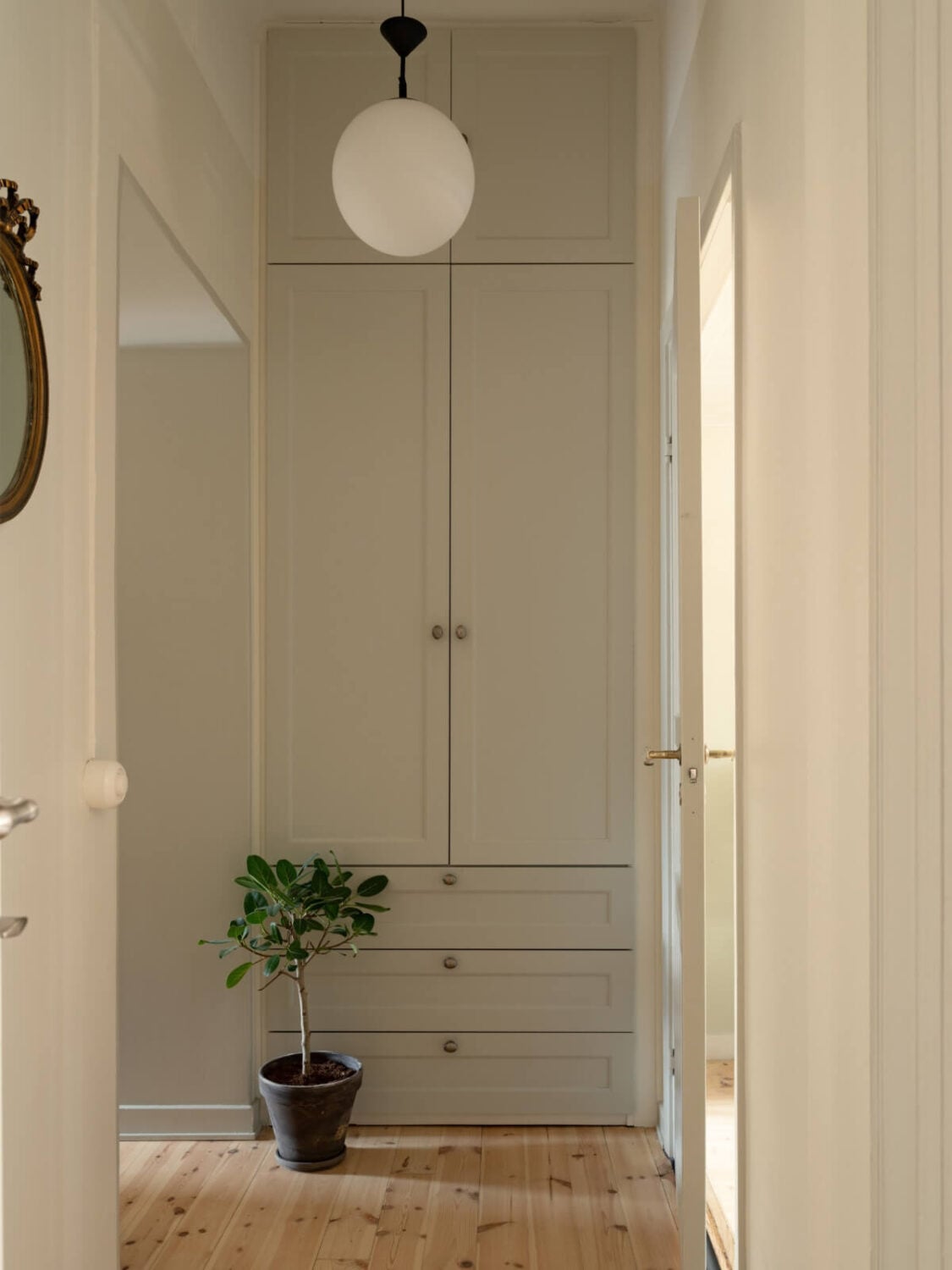 Soft Color Tones in a Renovated Turn-of-the-Century Apartment 26 hall with built-in wardrobes