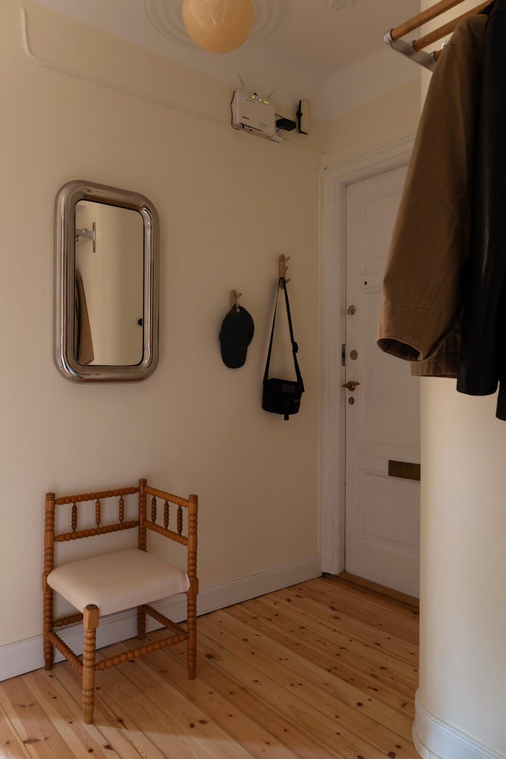 A Swedish Apartment with Period Features and Charming Color Pops 25 hall wooden floor 1 A Swedish Apartment with Period Features and Charming Color Pops