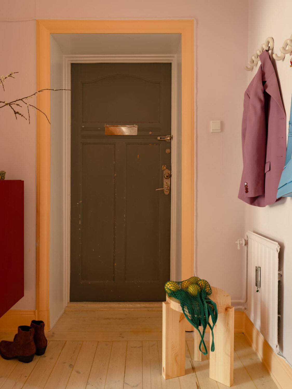 Cheerful Color Accents in a One-Bedroom Stockholm Apartment 20 hall yellow woodwork wooden floor Cheerful Color Accents in a One-Bedroom Stockholm Apartment