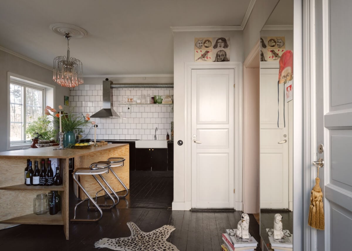 An Amazing Swedish House with Pink and Gray Rooms 9 kitchen black floorboards plywood island