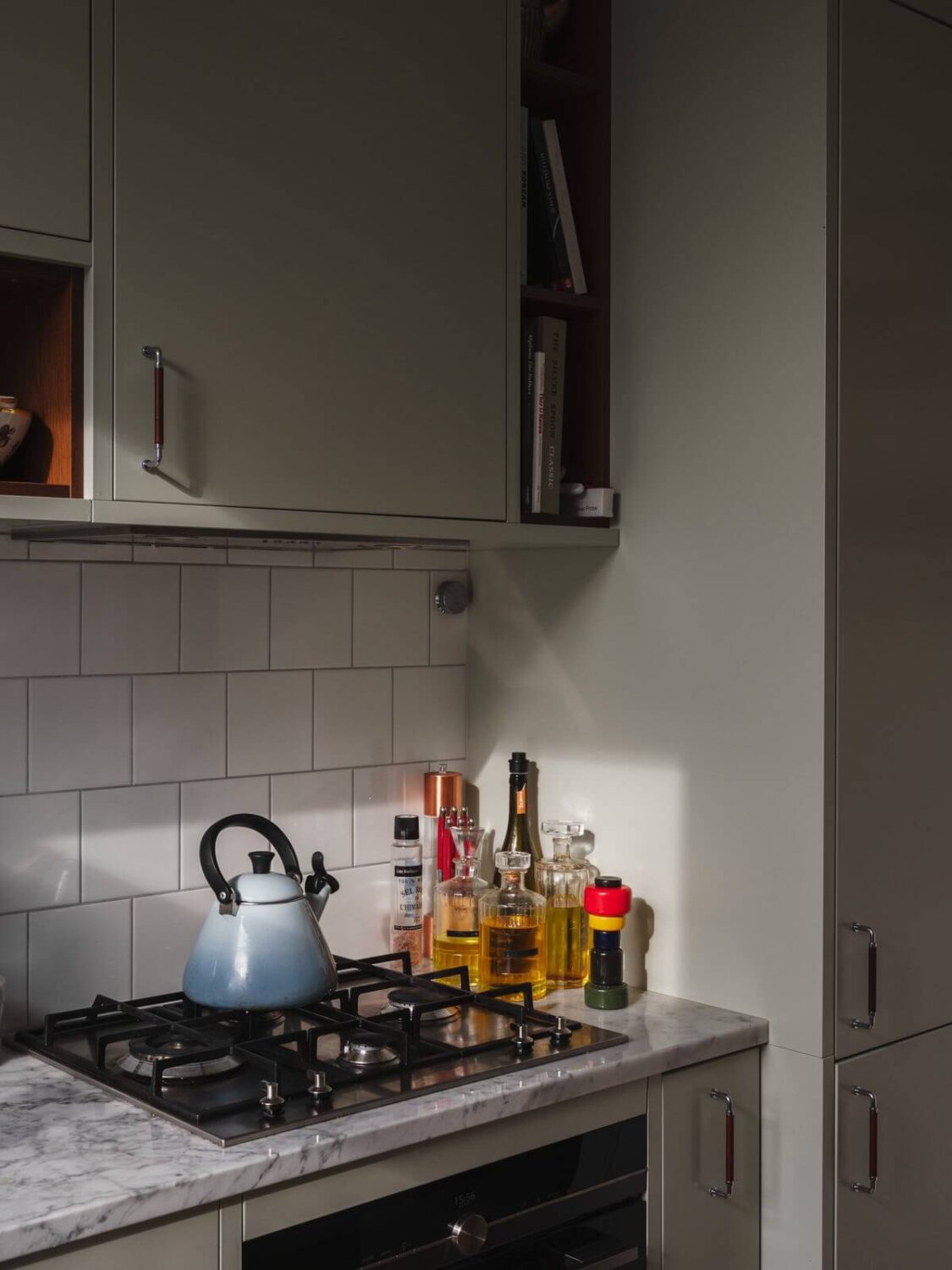 Gray Tones and Built-in Storage in a Charming Corner Apartment 12 kitchen detail