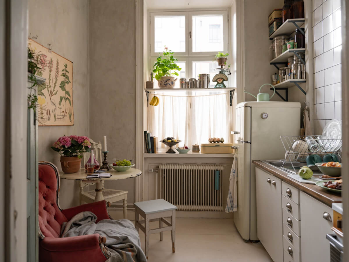 Time Has Stood Still in This Stockholm Studio Apartment 11 kitchen gray walls small round table