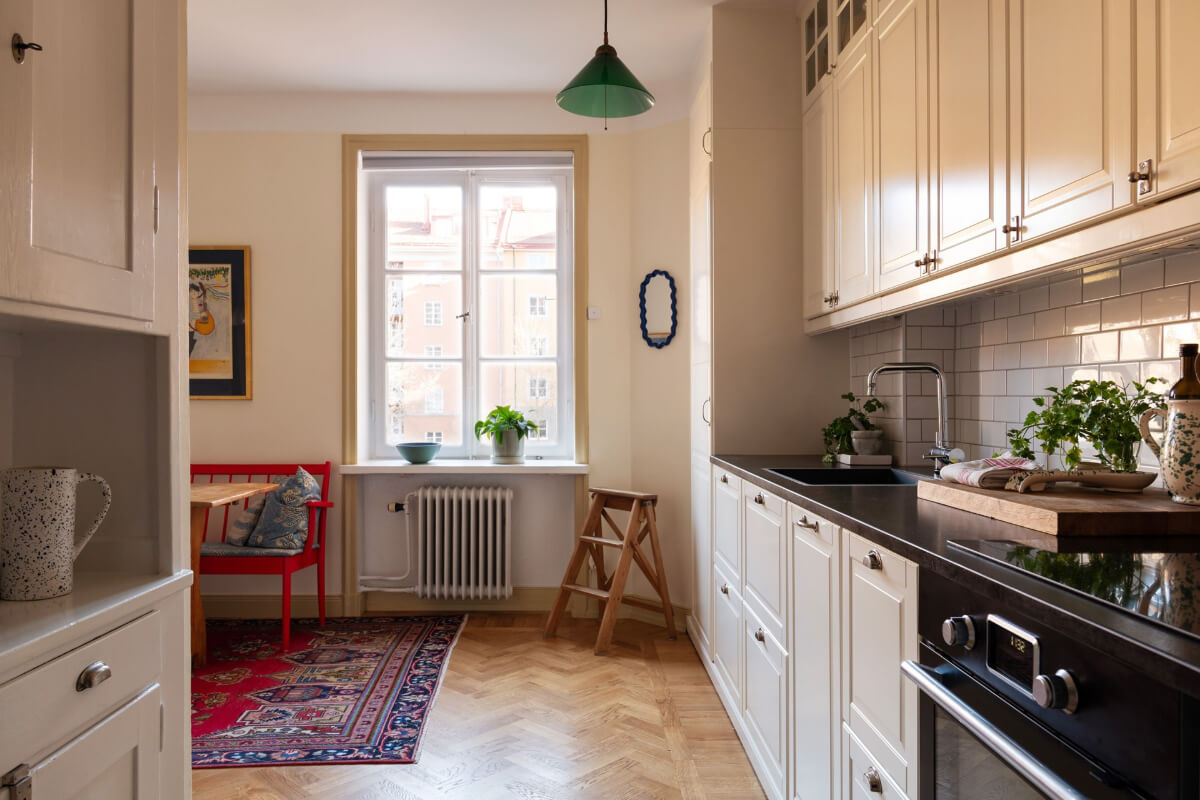 A Swedish Apartment with Period Features and Charming Color Pops 10 kitchen large window