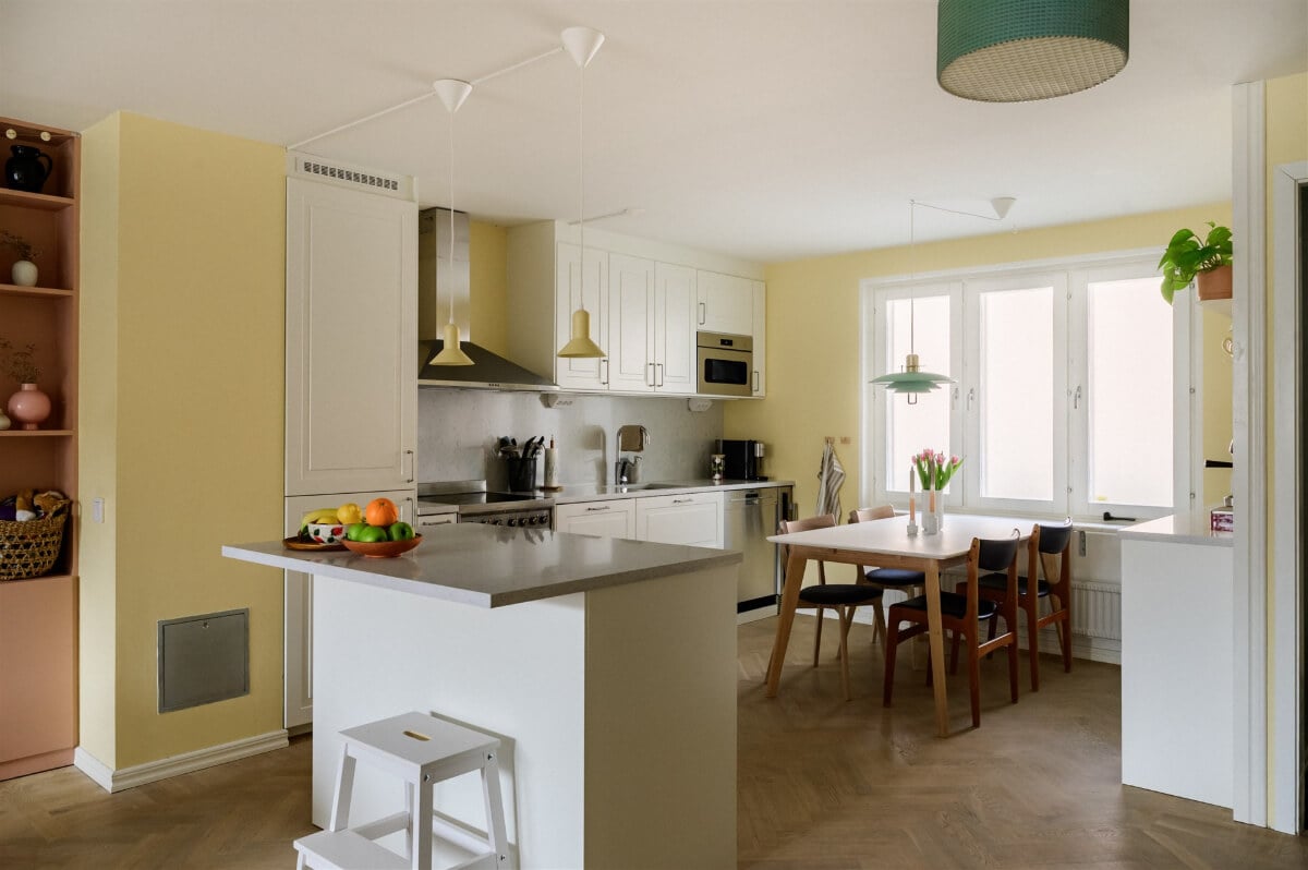 Colorful Rooms in a Bright Two-Bedroom Stockholm Apartment 10 kitchen pale yellow walls