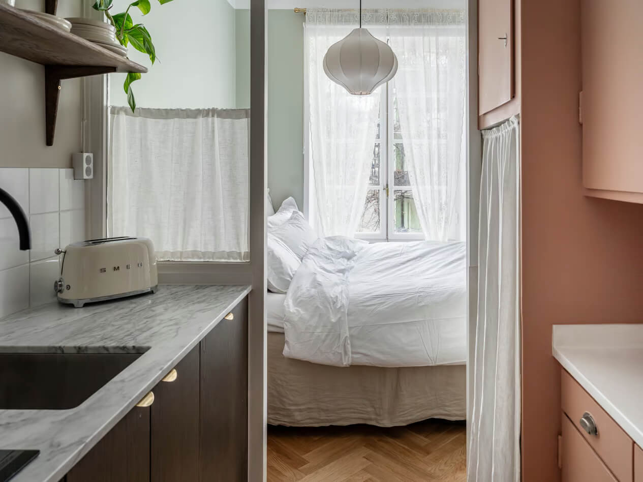 A Charming Small Apartment with a Cozy Bedroom Niche 9 kitchen view into bedroom