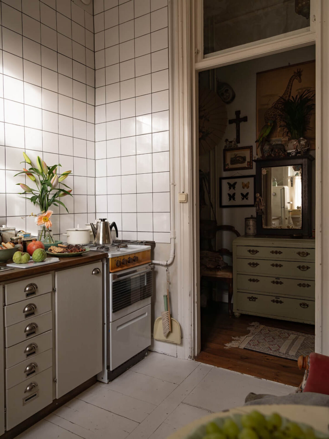 Time Has Stood Still in This Stockholm Studio Apartment 17 kitchen white tiles white painted floorboards