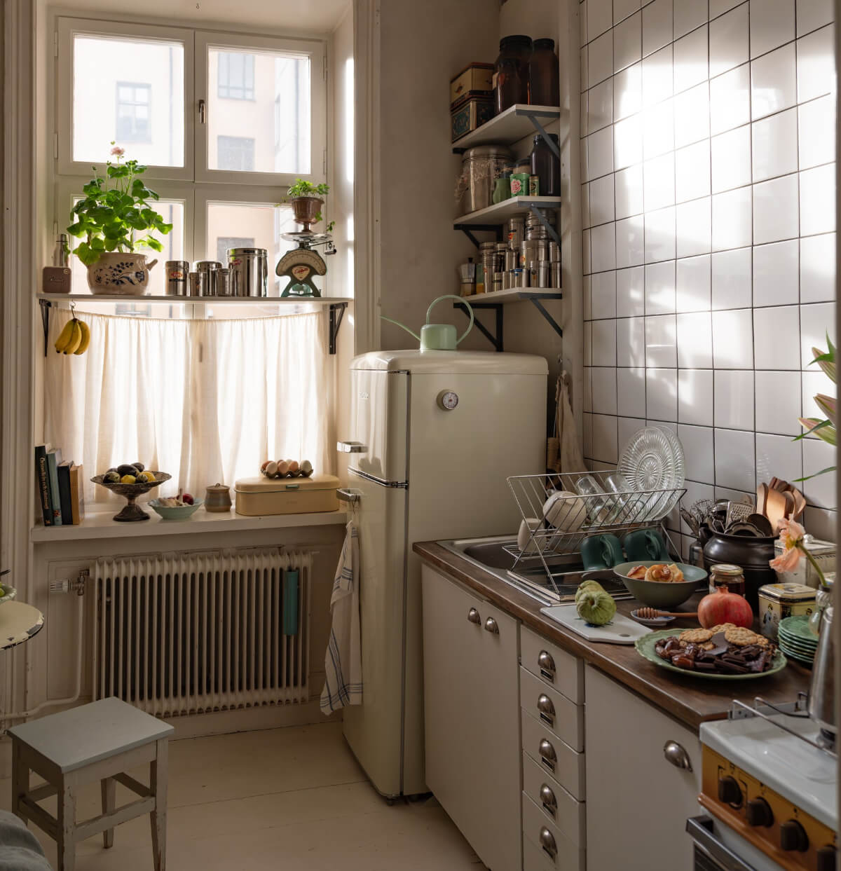 Time Has Stood Still in This Stockholm Studio Apartment 12 kitchen white tiles