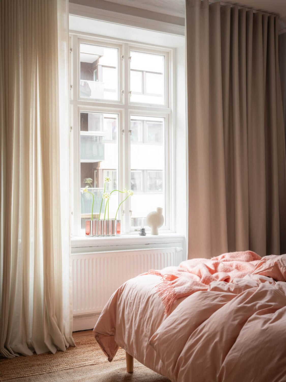 A Calm Color Palette in a Charming Swedish Apartment 19 large bedroom window