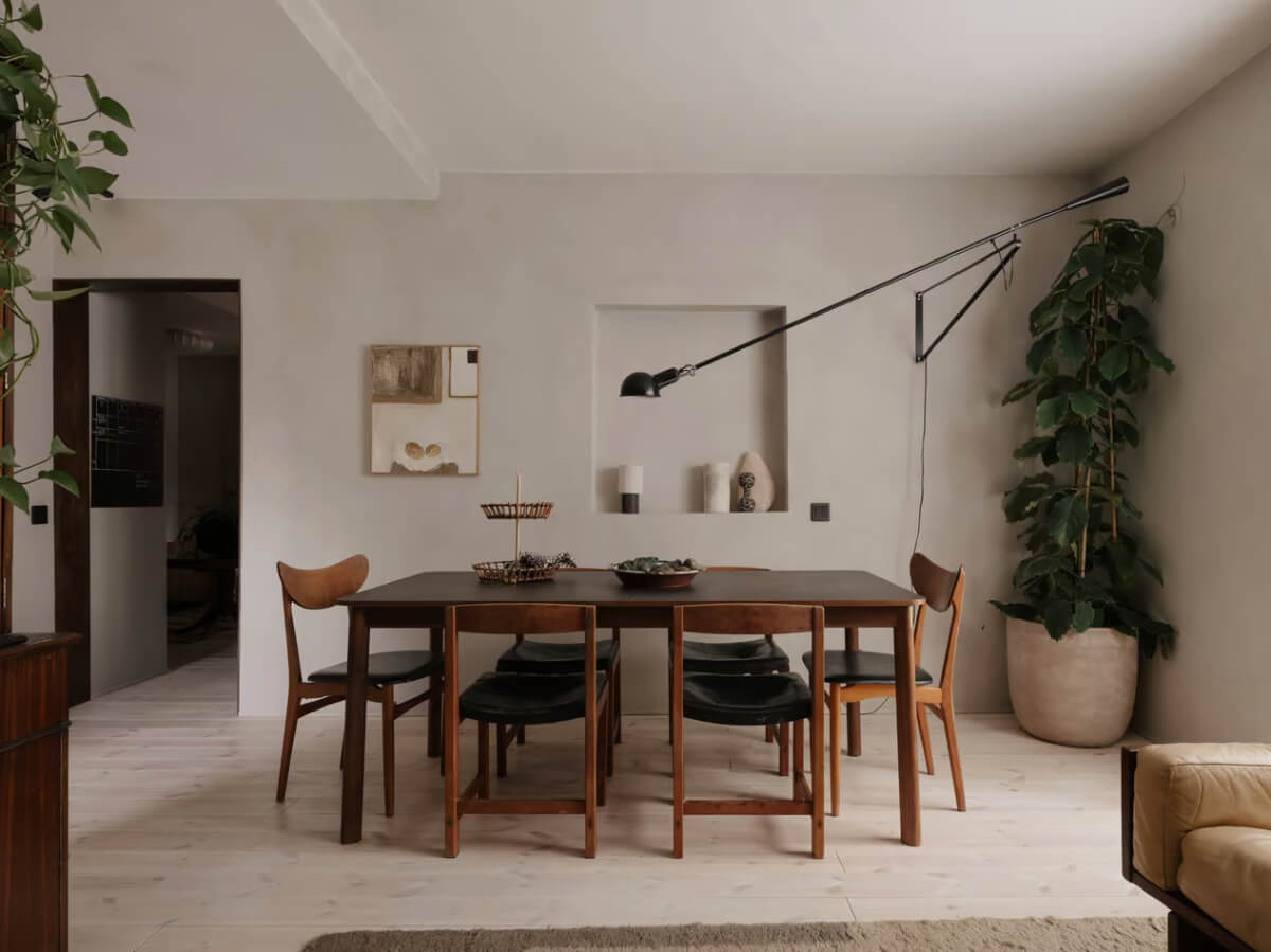 Limewash Walls in Muted Tones in a Swedish Apartment 5 large dining table plaster gray walls living space
