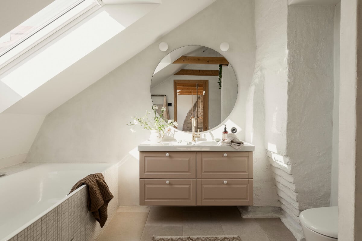 A Swedish Duplex Apartment Inspired by A Danish Summer House 14 light bathroom slanted ceiling bath