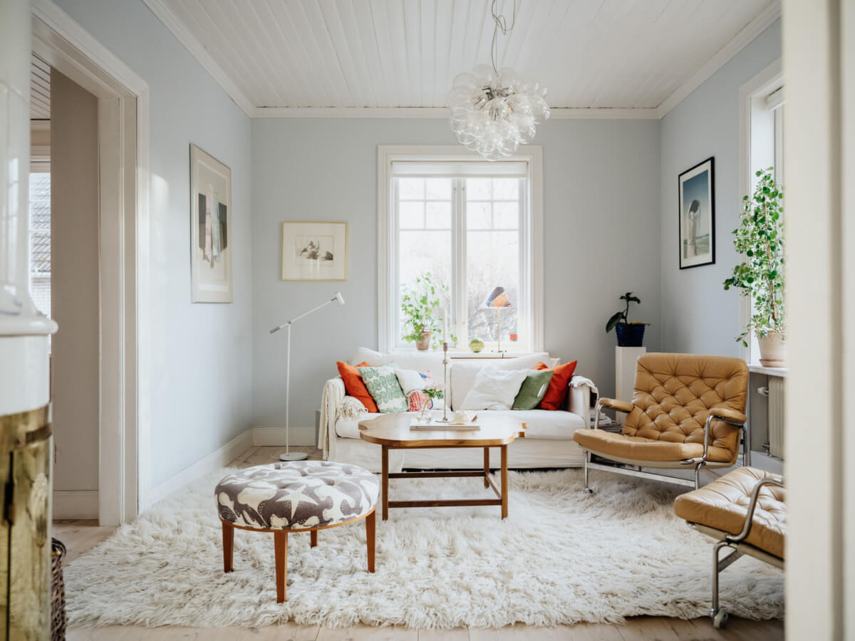 Light-Filled Rooms in a Charming 1907 Swedish Villa 9 light blue living room large shag rug