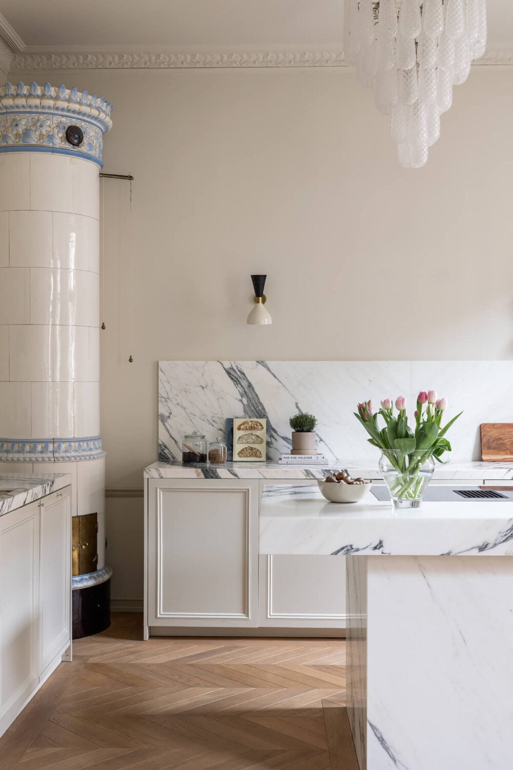 A Luxurious Stockholm Apartment with Period Features and a Blue Fireplace 10 light colored kitchen marble countertop fireplace