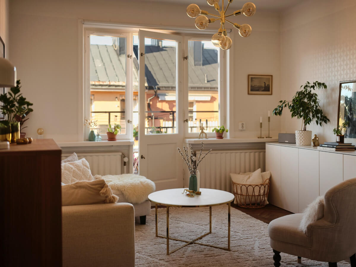A Light-Filled 1920s Apartment with Two Spacious Balconies 5 light colored living room