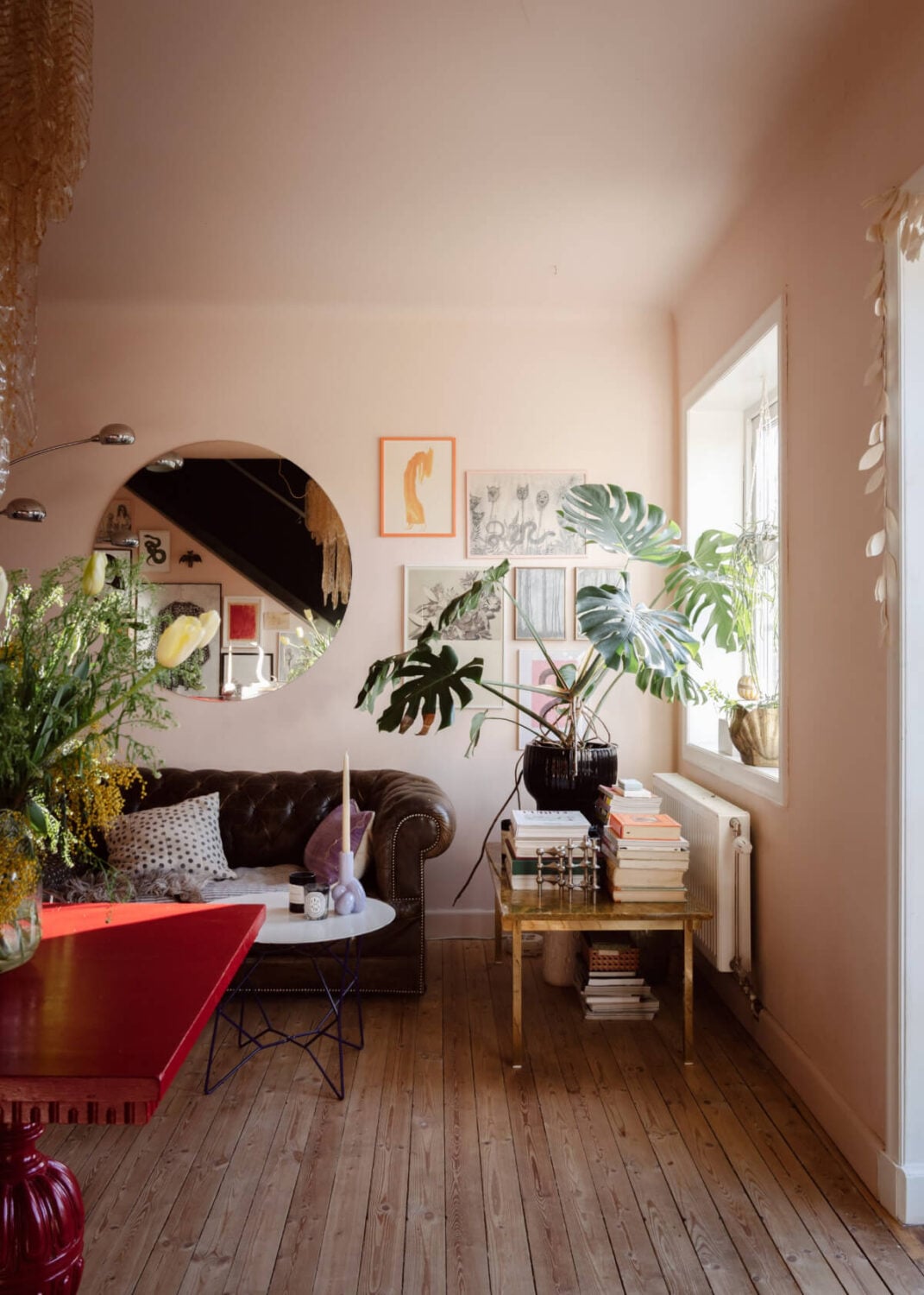 An Amazing Swedish House with Pink and Gray Rooms 4 light pink living room wooden floorboards chesterfield sofa
