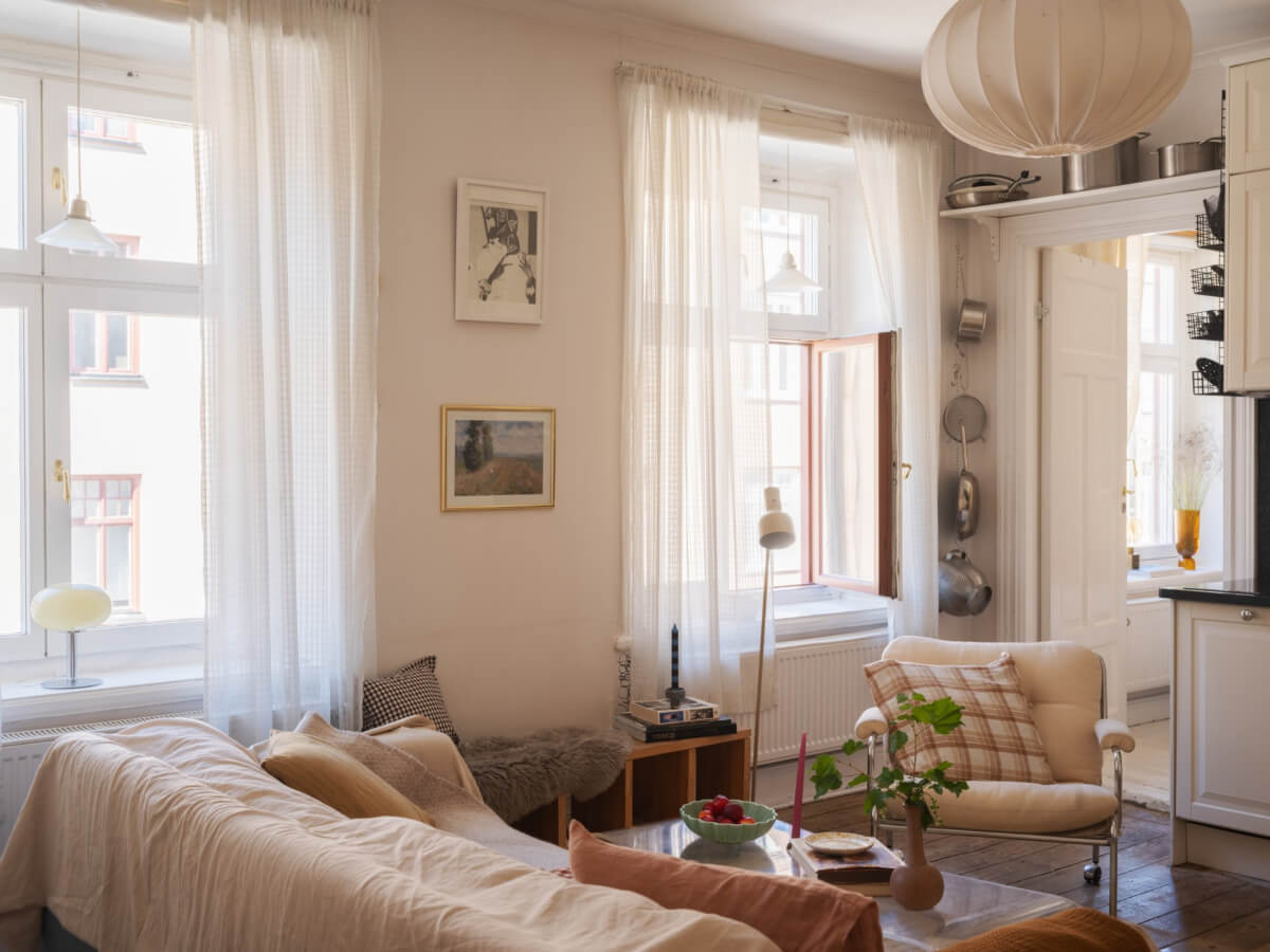 A Small Apartment with Rustic Floorboards and Beige Walls 10 light scandi living room