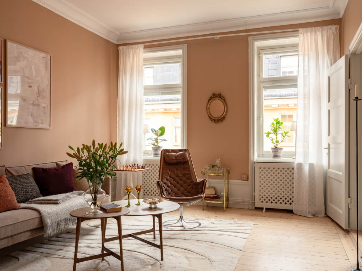 Soft Color Tones in a Renovated Turn-of-the-Century Apartment 1 living room earthy beige-pink walls