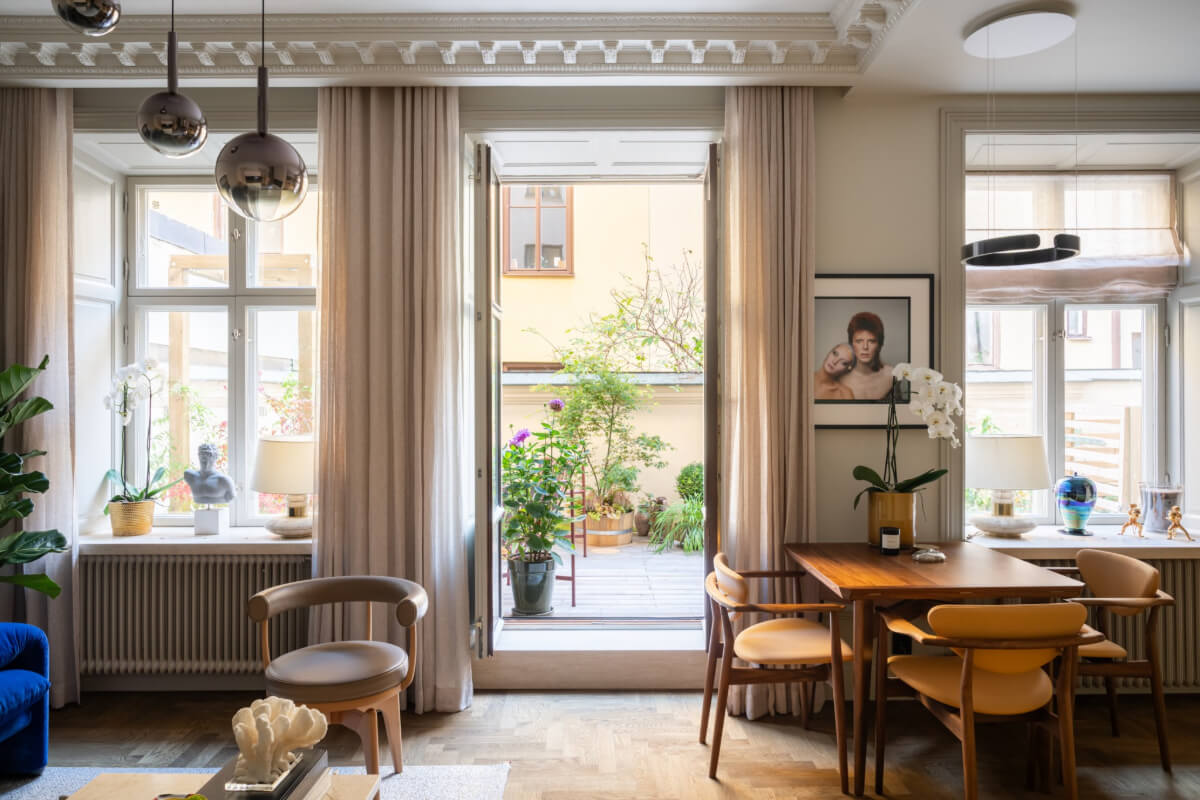 Hotel-Style Interiors in a Late 19th Century Apartment in Stockholm 9 living room glass doors to terrace