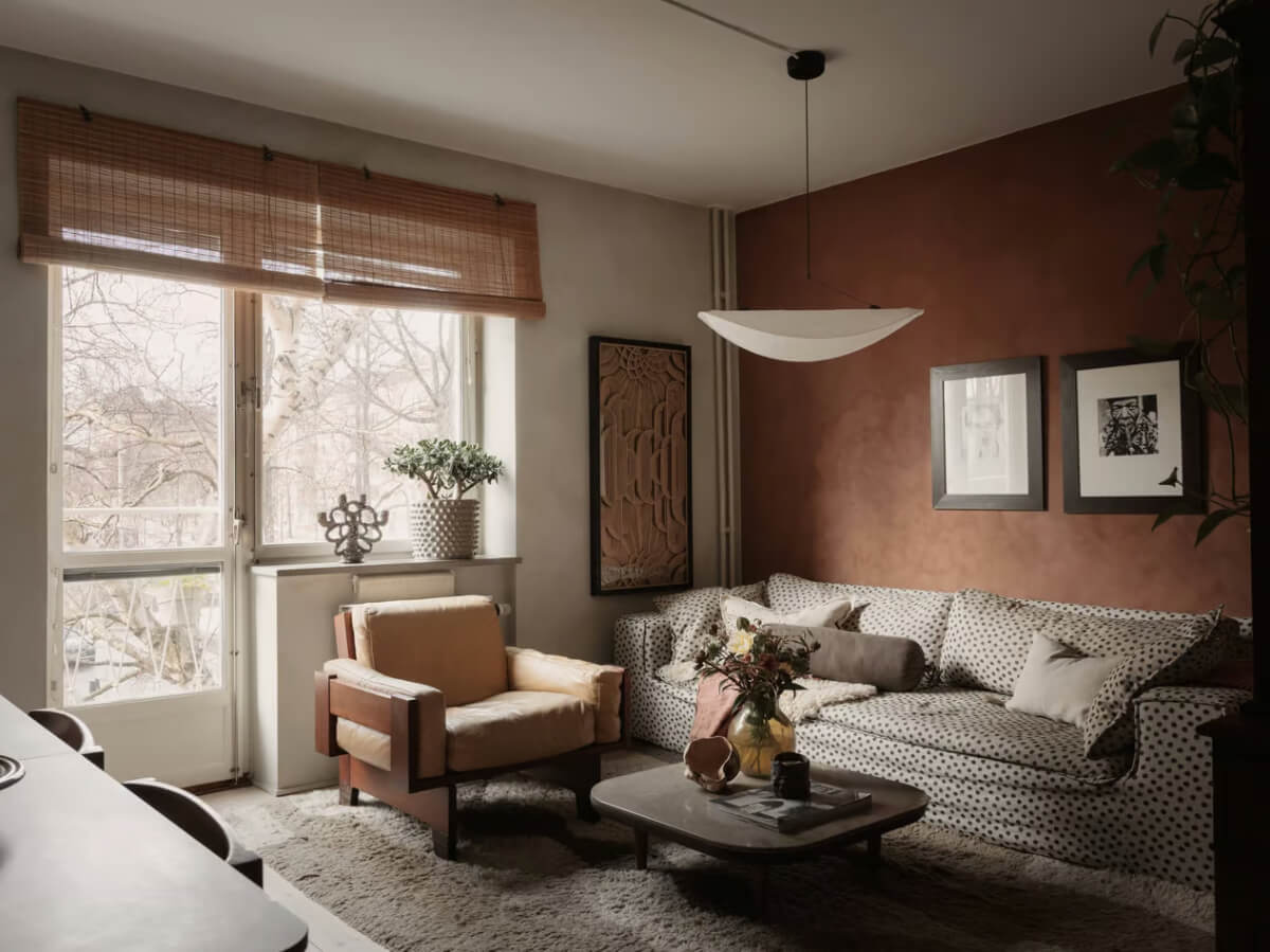 Limewash Walls in Muted Tones in a Swedish Apartment 2 living room terracotta accent wall