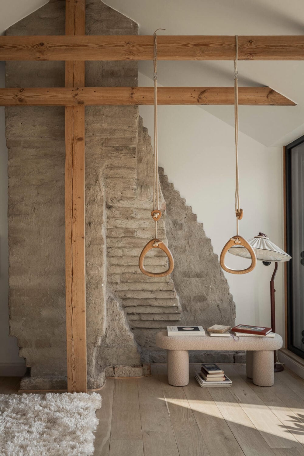 A Swedish Duplex Apartment Inspired by A Danish Summer House 2 living space exposed stone and woodwork