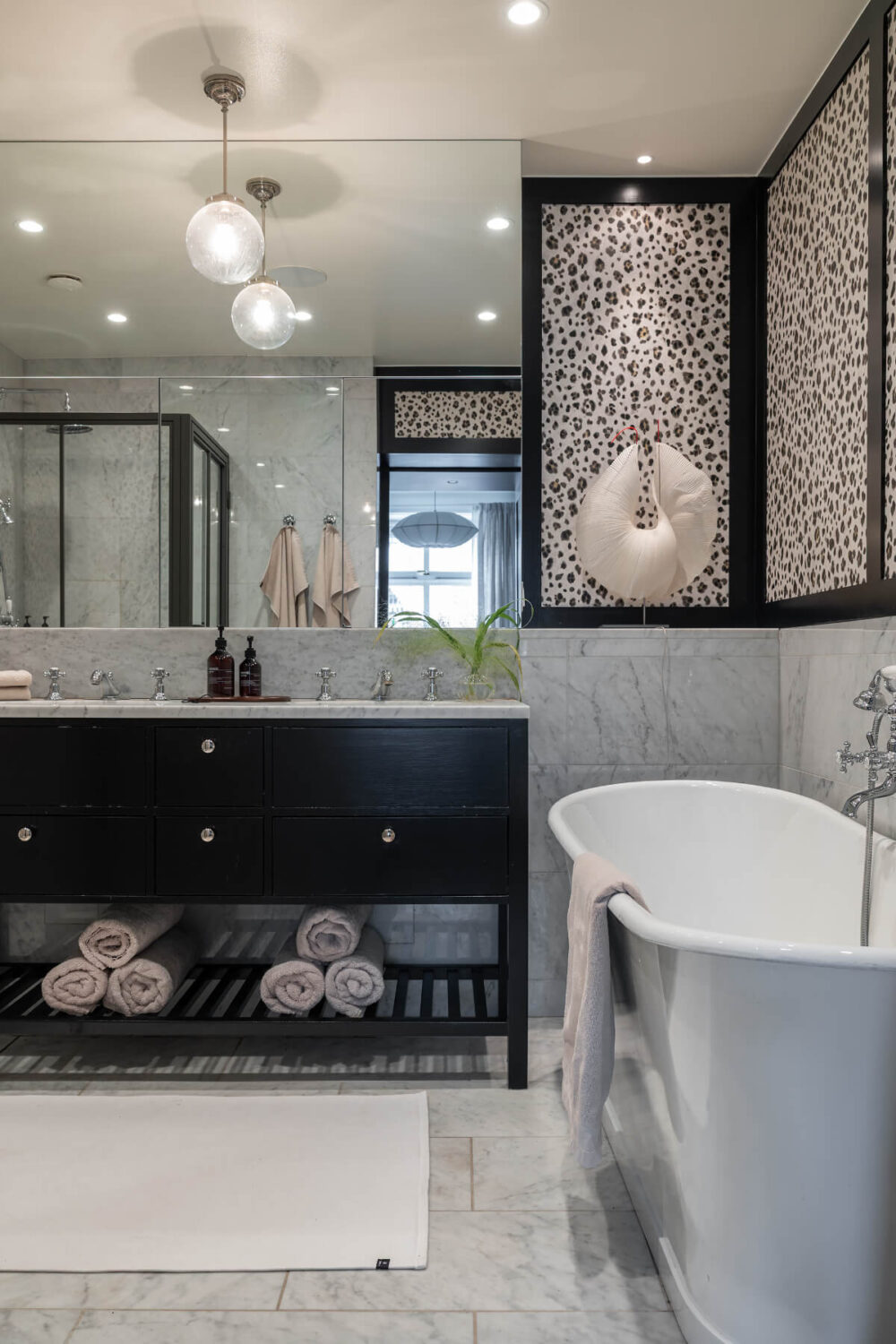 A Red Kitchen in a Grand Swedish Corner Apartment 18 marble bathroom black vanity freestanding bath