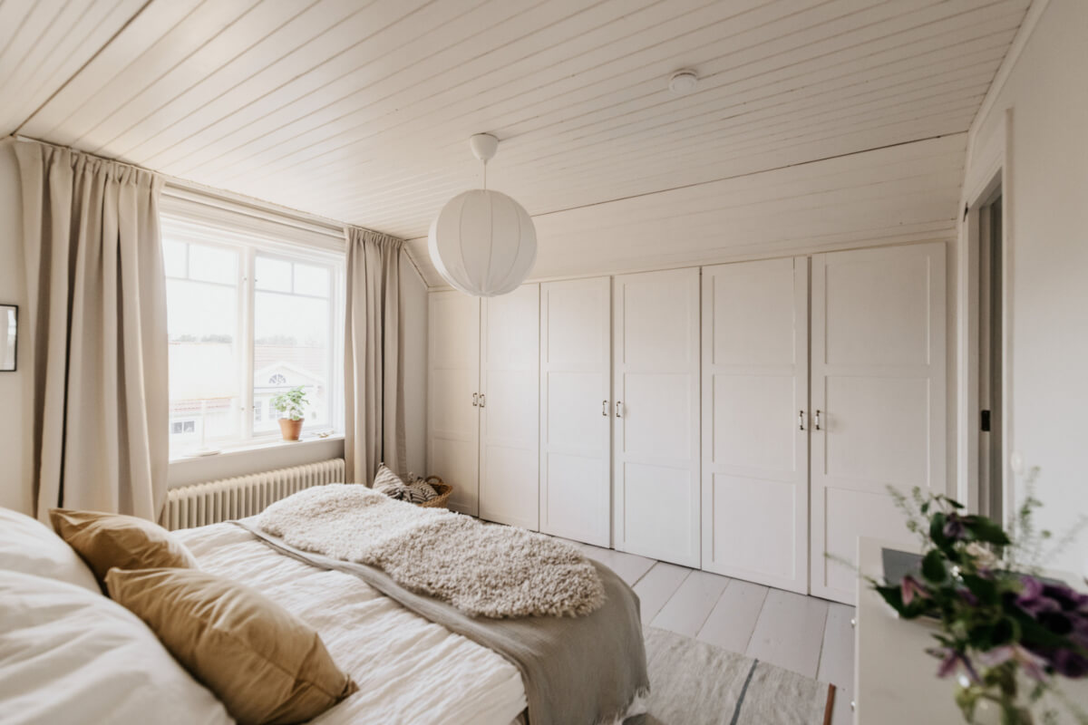 Light-Filled Rooms in a Charming 1907 Swedish Villa 24 master bedroom built-in wardrobes