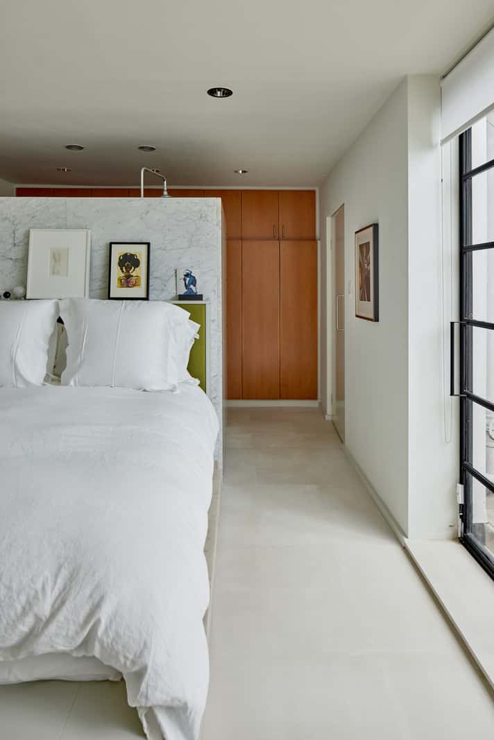 A Contemporary Architect-Designed Duplex Within a Grand Victorian Terrace 19 master suite with wardrobe wall