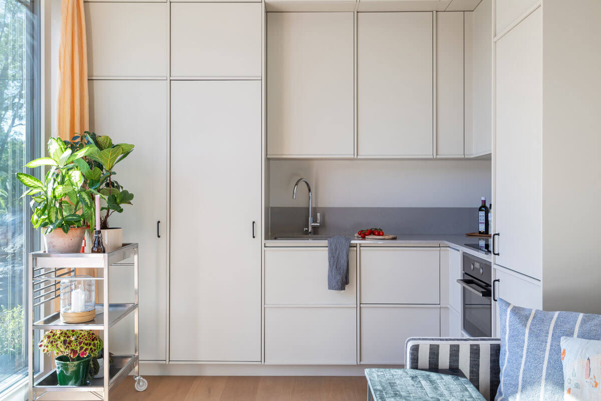 A Modern Tiny House in the Swedish Archipelago 7 minimalistic kitchen high upper cabinets