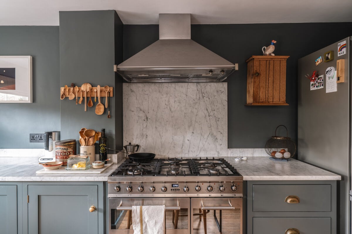 A Cozy Victorian Home Painted in Moody Blue and Gray Tones 12 moody kitchen marble countertop