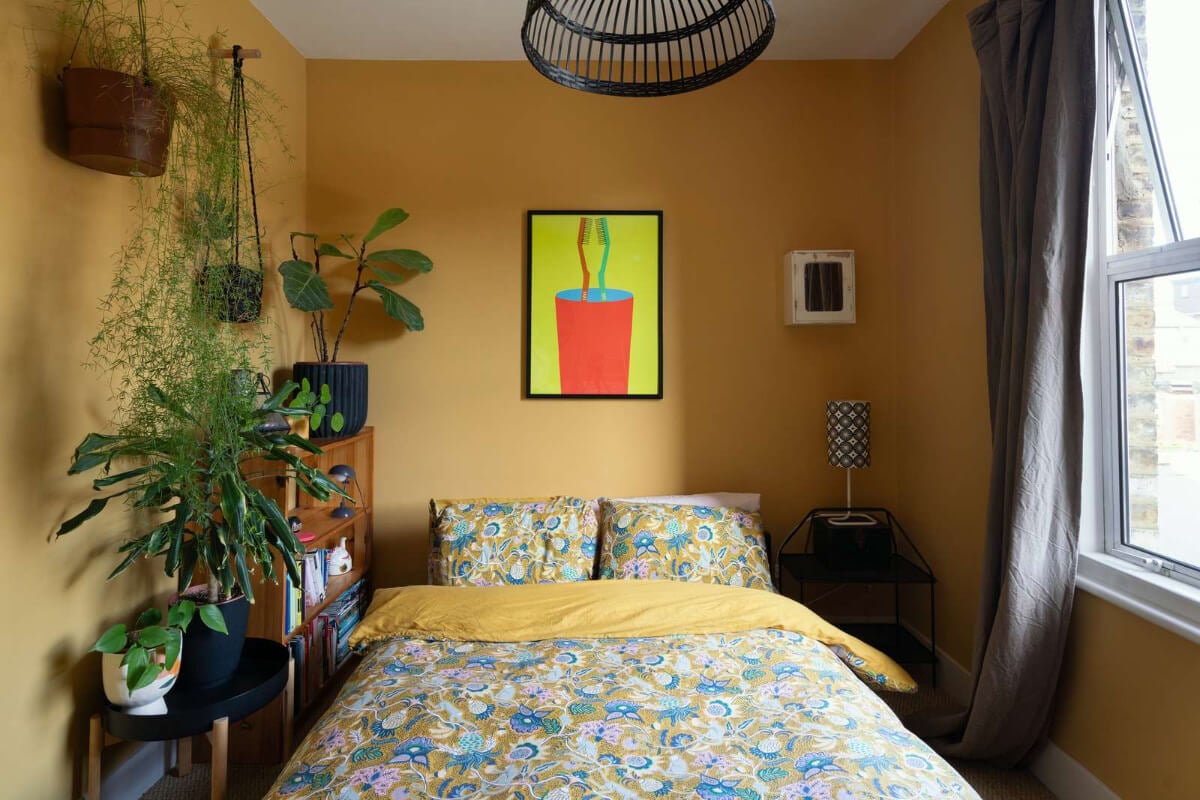 A Colorful Home with a Gold Extension in North London 18 ochre yellow bedroom with plants