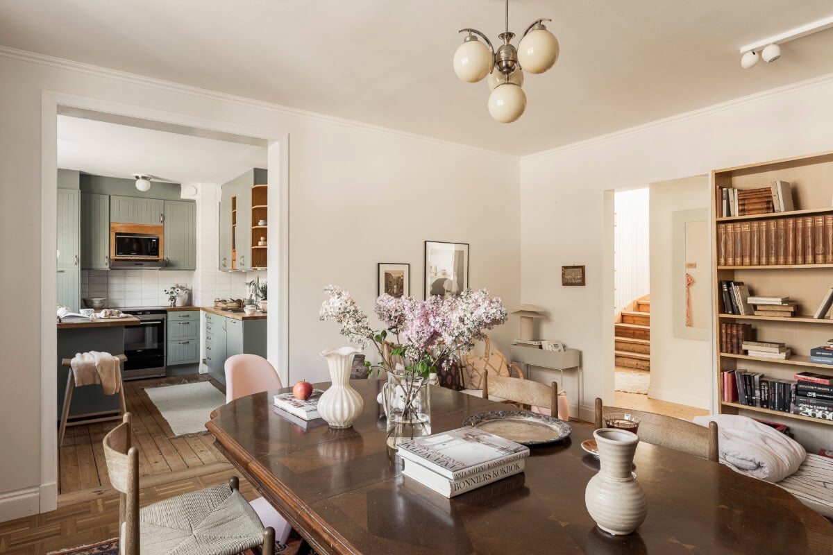 A Swedish Duplex Apartment Inspired by A Danish Summer House 19 open-plan kitchen and dining room antique table