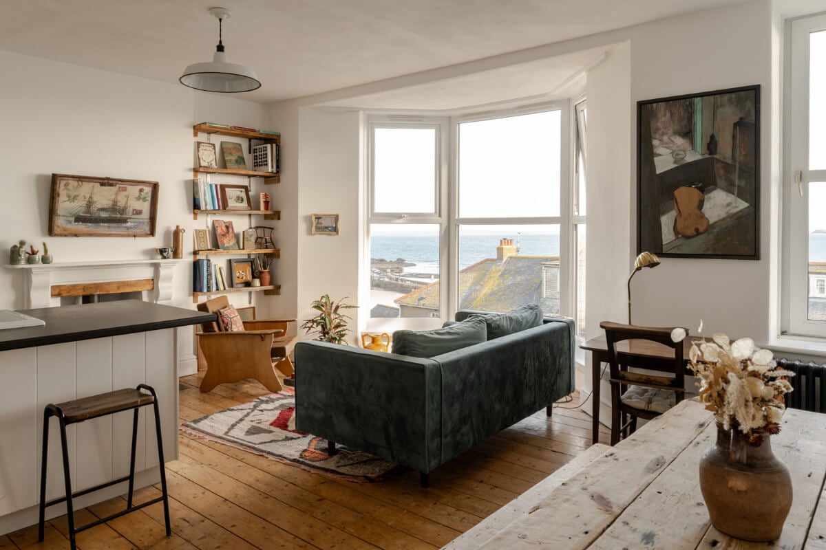 A Small Victorian Apartment by the Sea in Cornwall 1 open plan living room bay window wooden floorboards