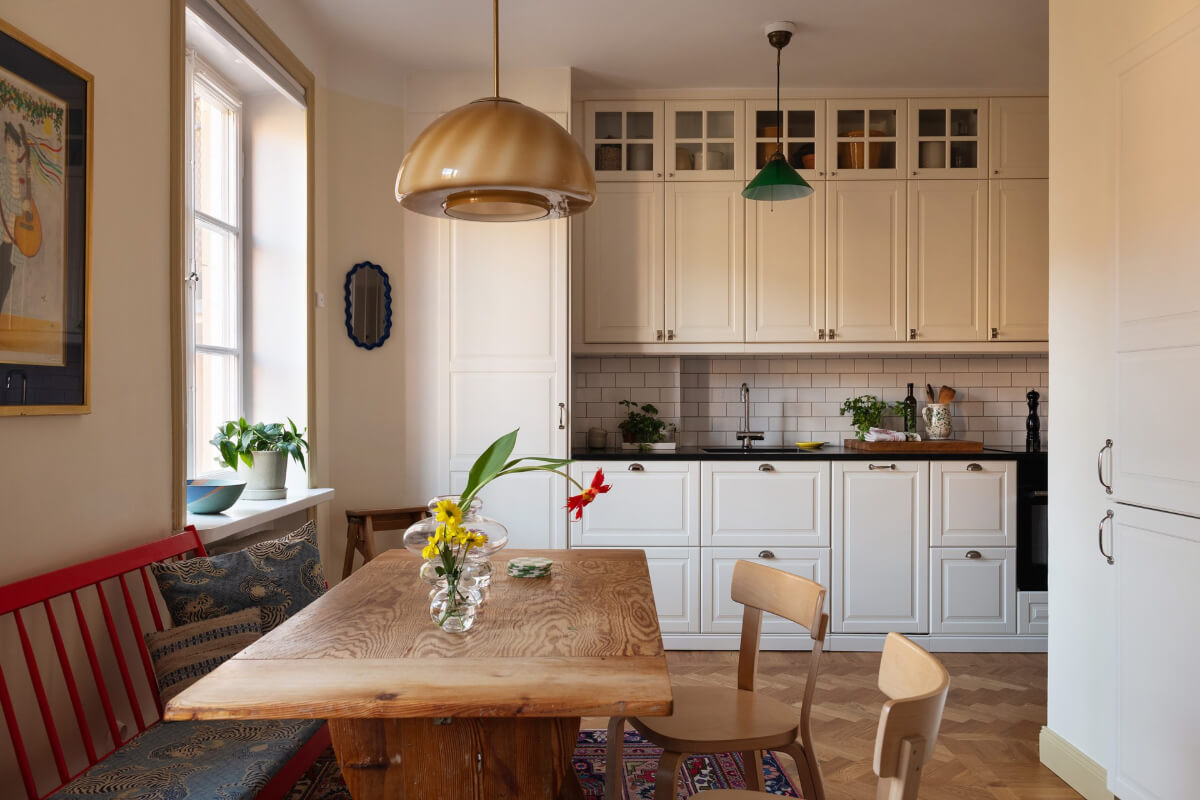 A Swedish Apartment with Period Features and Charming Color Pops 8 open plan living space classic kitchen