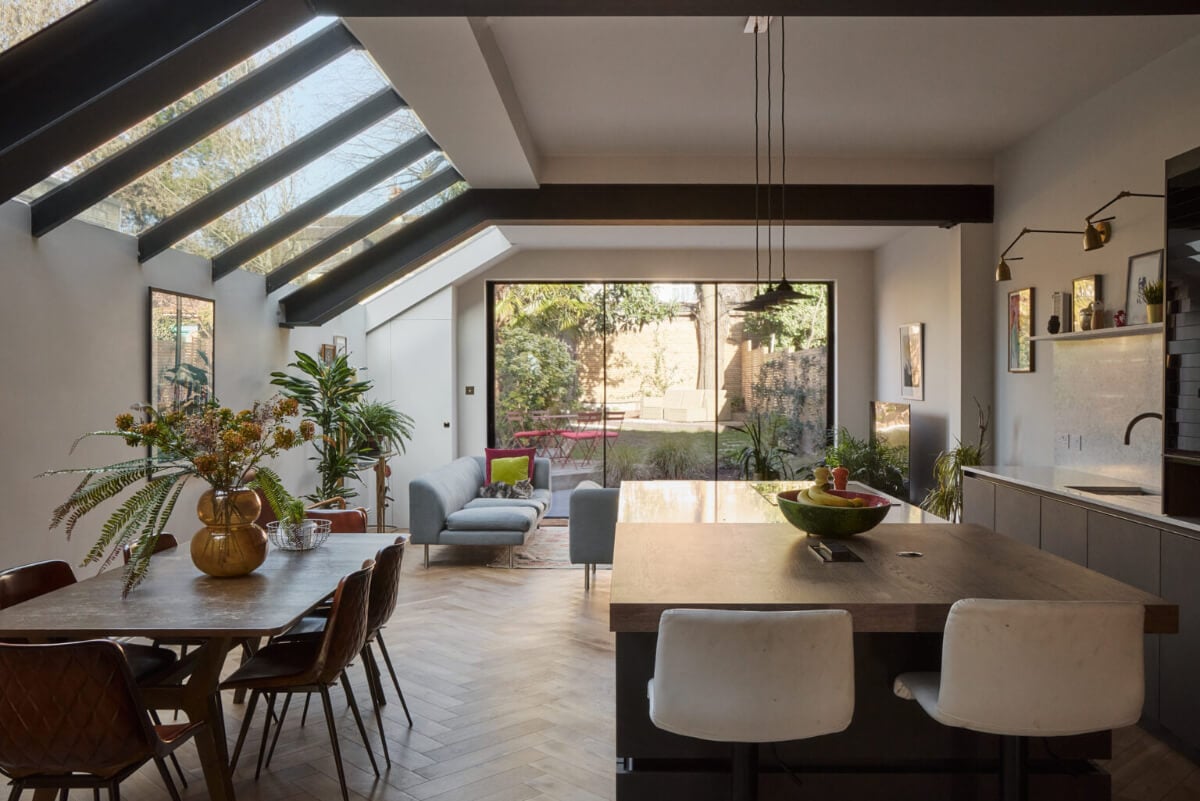 A Beautiful Extended Edwardian House Blends Period Features with Modern Design 8 open plan living space skylights herringbone floor