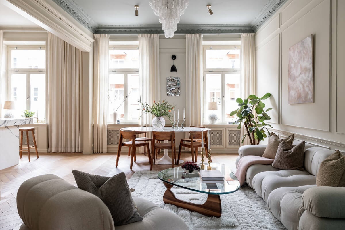A Luxurious Stockholm Apartment with Period Features and a Blue Fireplace 1 open plan scandinavian living space large windows