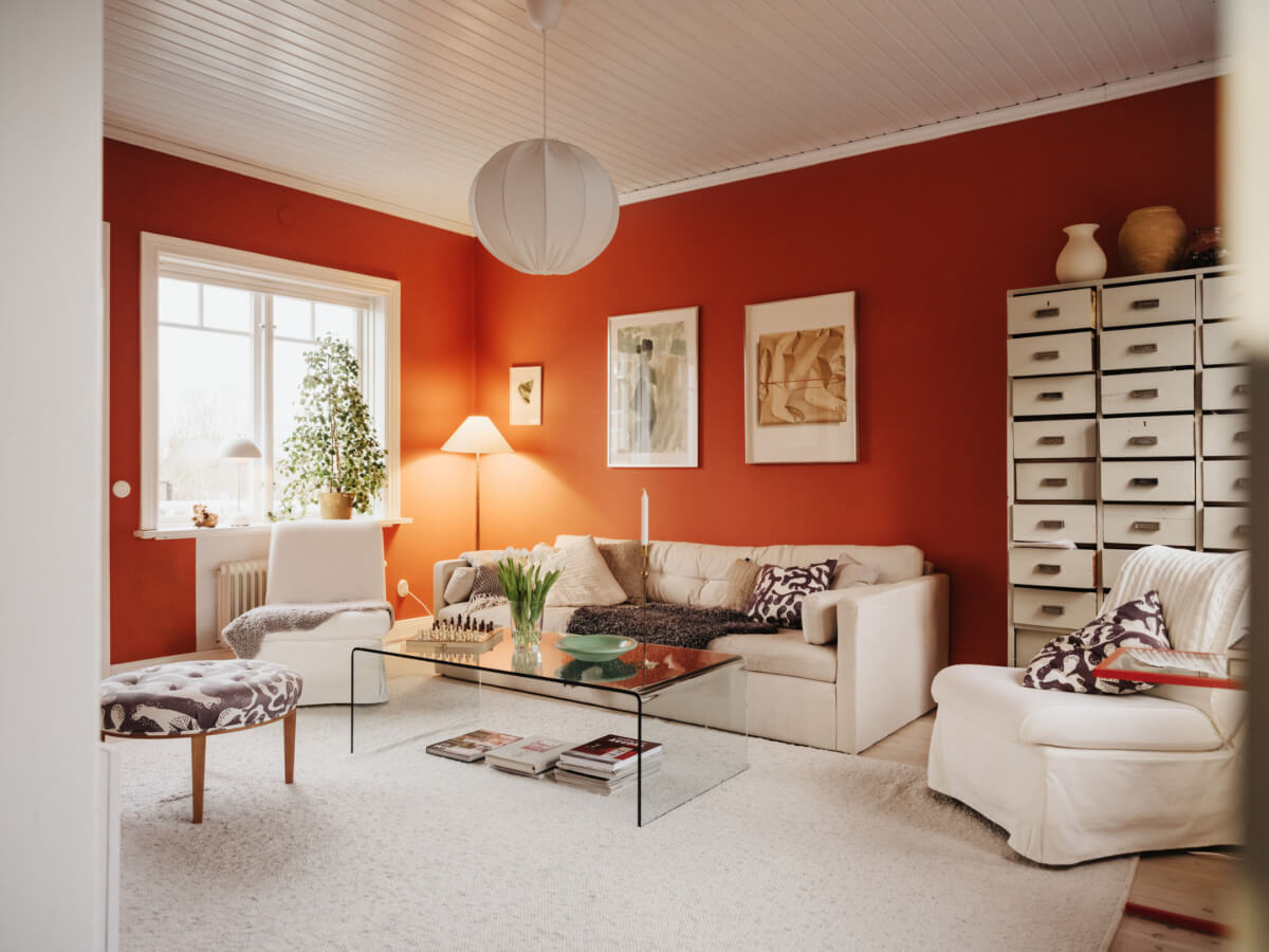 Light-Filled Rooms in a Charming 1907 Swedish Villa 15 orange-red living room