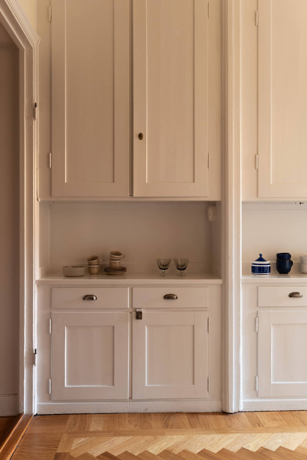 A Swedish Apartment with Period Features and Charming Color Pops 13 original built-in cabinets