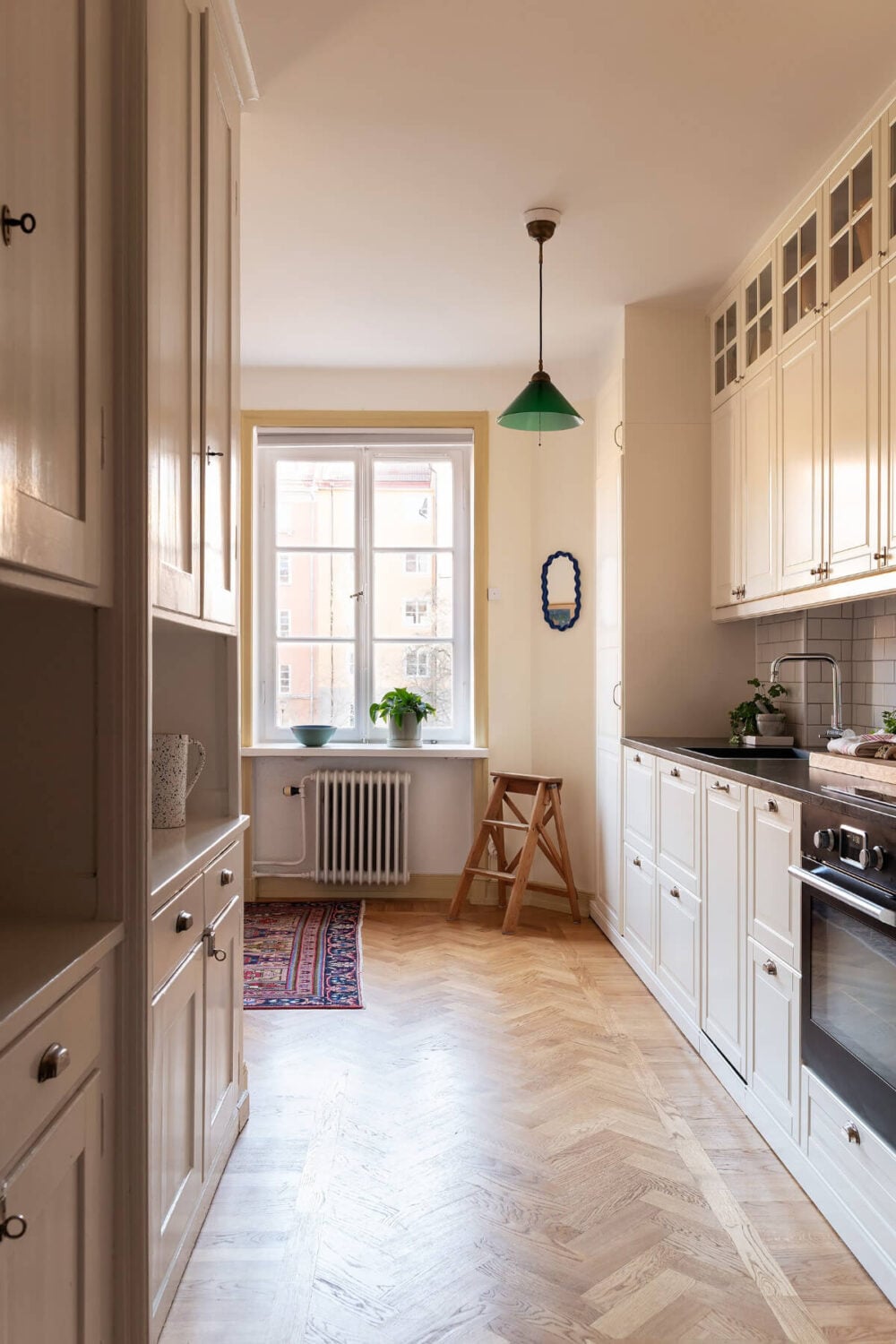A Swedish Apartment with Period Features and Charming Color Pops 12 original cabinets kitchen